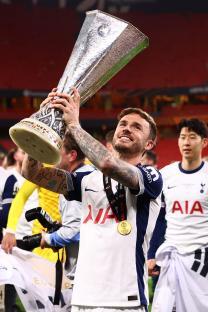 James Maddison of Tottenham holding the UEFA Europa League trophy.