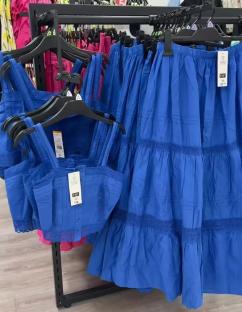Blue crop top and maxi skirt set on display.