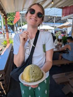 Woman holding a shave ice in Hawaii.
