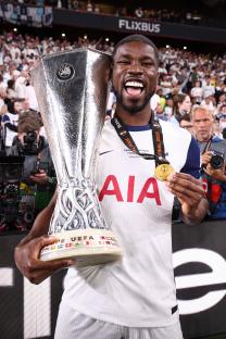 Kevin Danso of Tottenham Hotspur holding the Europa League trophy.