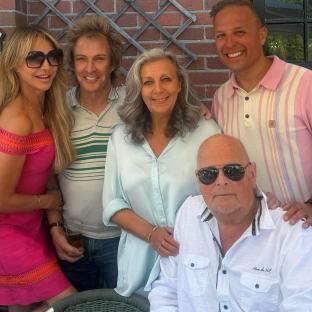Group photo of five adults.