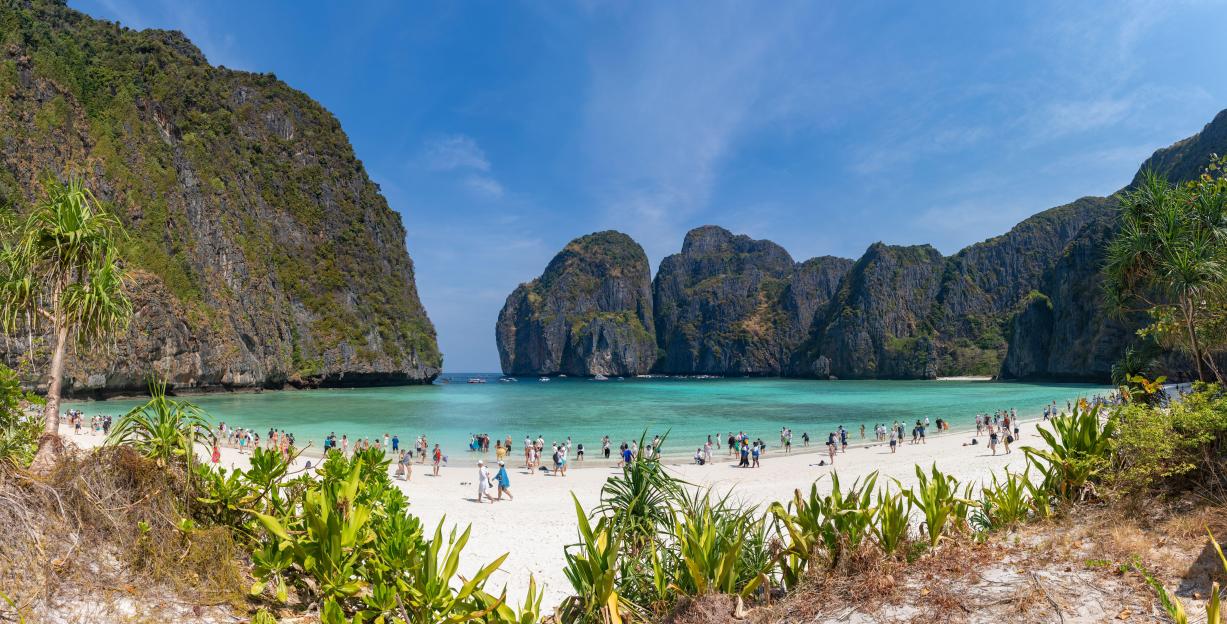 Maya Bay, Ko Phi Phi Lee Island, Thailand; beach with tourists.