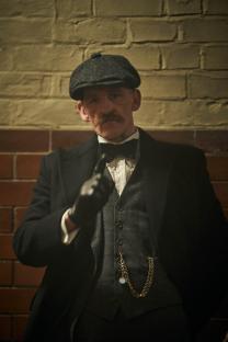 Arthur Shelby from Peaky Blinders gesturing.
