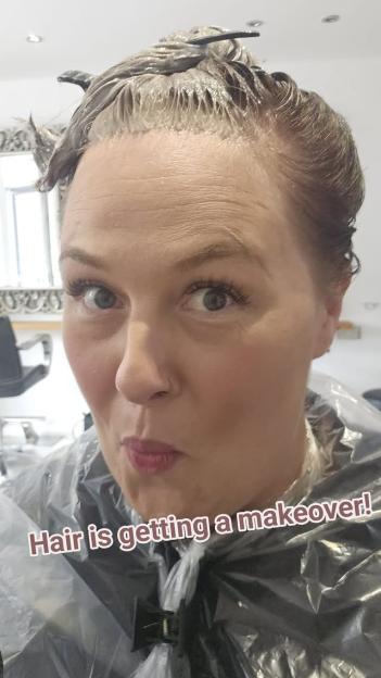 Woman getting her hair dyed.