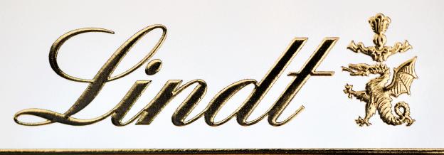 Lindt logo with gold lettering and dragon crest.