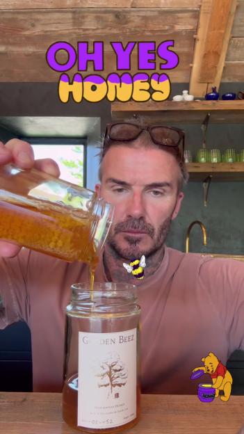 David Beckham pouring honey into a jar labeled "Golden Beez Maplewood Honey," with text "OH YES HONEY" and illustrations of a bee and Winnie the Pooh.