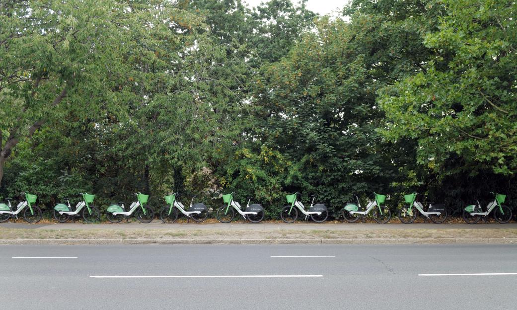 Person loading Lime bikes into a van.