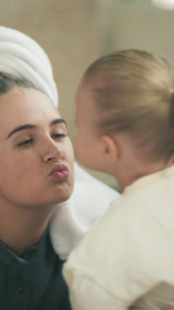 Molly-Mae Hague making a kissing face at her baby.