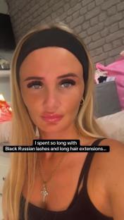 Woman with long blonde hair extensions and black Russian lashes.