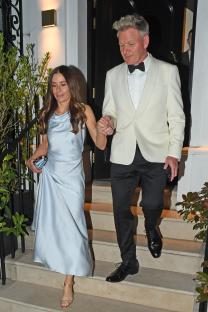 Gordon and Tana Ramsay leaving a restaurant.