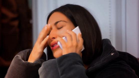 Kim Kardashian crying on a phone call.