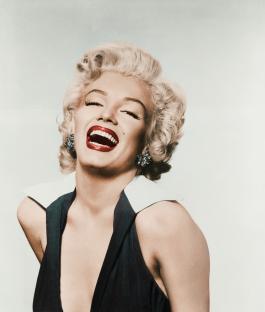 Portrait of Marilyn Monroe laughing.