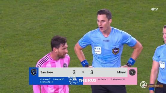 Lionel Messi arguing with a referee during a soccer game.