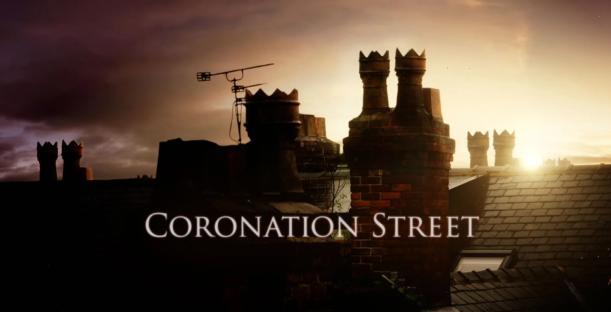 Coronation Street HD logo with rooftops at sunset.