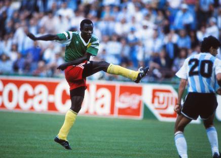 Emmanuel Kunde of Cameroon kicking the ball during a 1990 World Cup match.