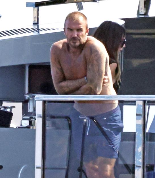 David Beckham shirtless on a yacht.