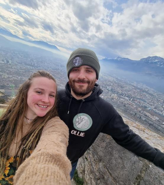 Selfie of Libby and Ollie overlooking a city.