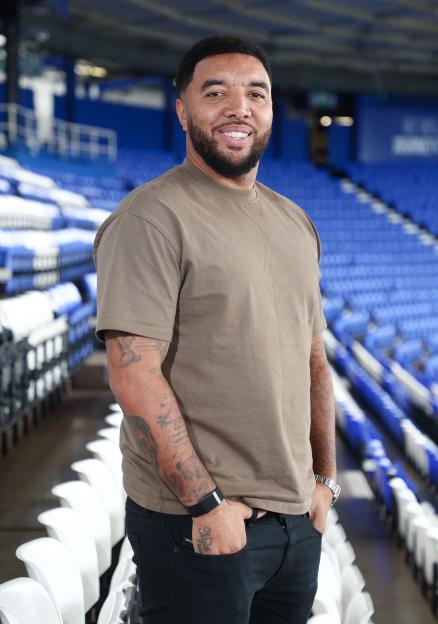 Troy Deeney smiling at a football stadium