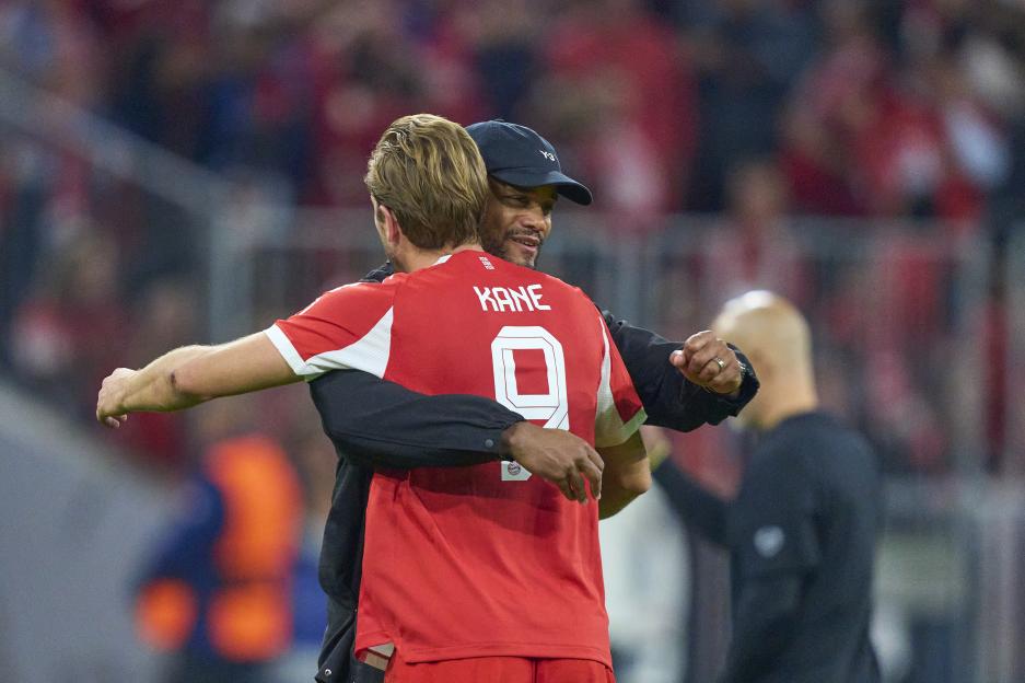 Harry Kane and Vincent Kompany embracing.