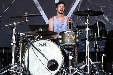 Daniel Williams of The Devil Wears Prada drumming at the Vans Warped Tour.