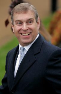 Britain's Duke of York, Prince Andrew, reacts to Christmas greetings from photographers as he arrives at St Mary Magdalene church on the Sandringham estate as members of the British Royal family attend the traditional Christmas Day church service in Sandringham, 25 December 2006. Queen Elizabeth II and senior members of Britain's royal family made their annual Christmas Day outing to church on Monday to attend morning service. The 80-year-old monarch, dressed in a cherry-coloured hat and pink coat, led the way into Saint Mary Magdalene Church, near her country retreat at Sandringham in Norfolk, eastern England. AFP PHOTO / AP / POOL / Matt Dunham (Photo credit should read MATT DUNHAM/AFP/Getty Images)