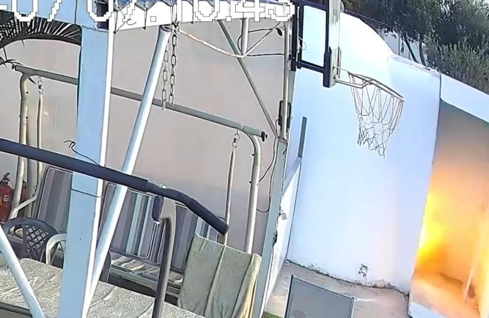 Fire near a basketball hoop.