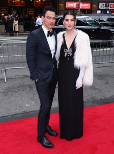 Julianna Margulies and her husband on a red carpet.
