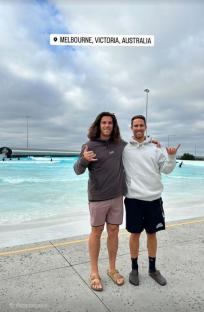 Two men posing at a surf park in Melbourne, Australia.