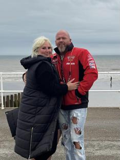 Couple embracing at the beach.