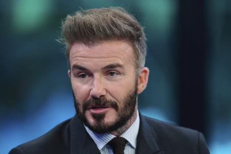 David Beckham speaking at an event.
