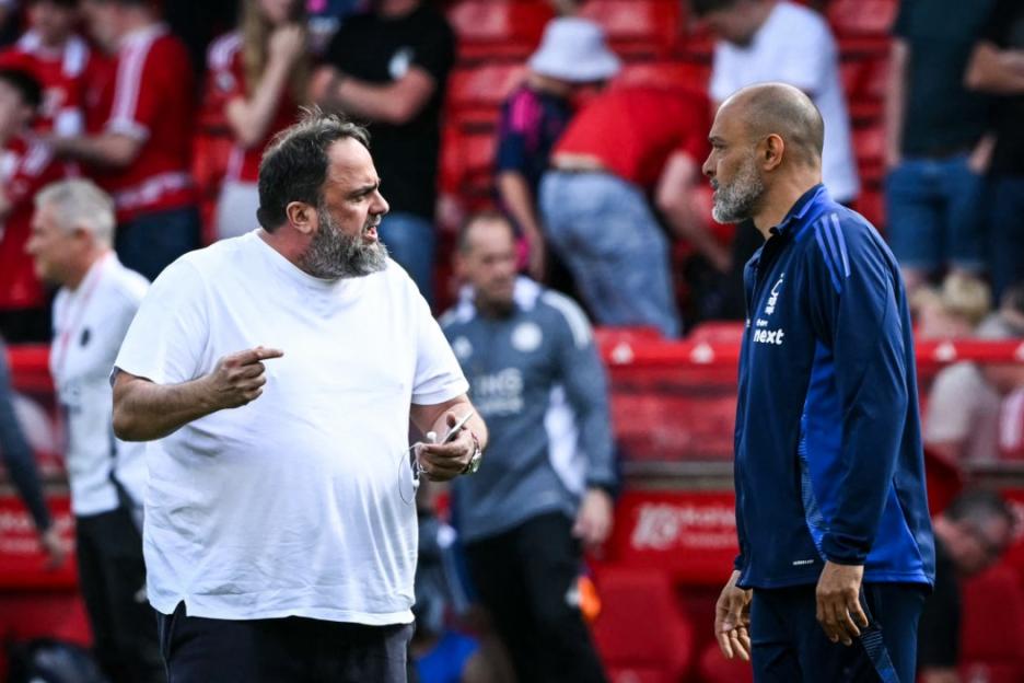 (FILES) Nottingham Forest's Portuguese manager Nuno Espirito Santo (R) speaks with Nottingham Forest's Greek co-owner Evangelos Marinakis (L) at the end of the English Premier League football match between Nottingham Forest and Leicester City at The City Ground in Nottingham, central England, on May 11, 2025. Head coach Nuno Espirito Santo was sacked by Nottingham Forest early on September 9 after 21 months in charge at the Premier League club. Nuno becomes the first Premier League manager to lose his job this season, two weeks after admitting his relationship with club owner Evangelos Marinakis had deteriorated. (Photo by JUSTIN TALLIS / AFP) / RESTRICTED TO EDITORIAL USE. No use with unauthorized audio, video, data, fixture lists, club/league logos or 'live' services. Online in-match use limited to 120 images. An additional 40 images may be used in extra time. No video emulation. Social media in-match use limited to 120 images. An additional 40 images may be used in extra time. No use in betting publications, games or single club/league/player publications. / (Photo by JUSTIN TALLIS/AFP via Getty Images)