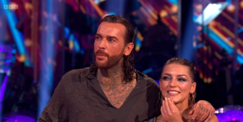 Pete Wicks and Jowita Przysta looking up at Strictly Come Dancing judges.