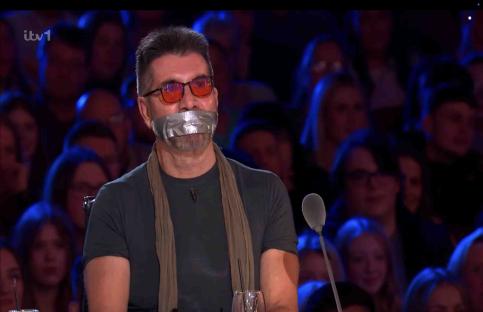 Simon Cowell with tape over his mouth on Britain's Got Talent.