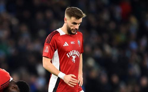 Salford City's Tyrese Fornah and Luke Garbutt looking dejected.