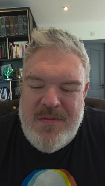 Close-up of DJ Kristian Nairn with eyes closed.