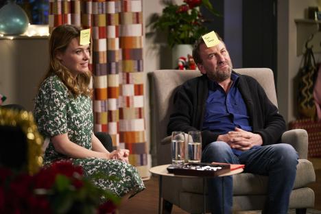 Lee Mack and Sally Bretton playing a game with names on their foreheads.