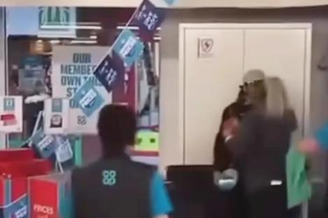 Moment Co-op worker grabs fleeing shoplifter by the THROAT to stop him making off with arms full of stolen items