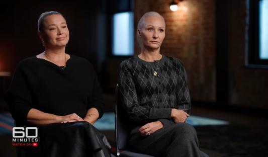 Two women sit for an interview.