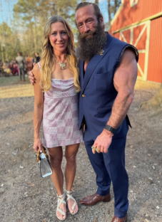 Liver King and a woman posing for a photo.
