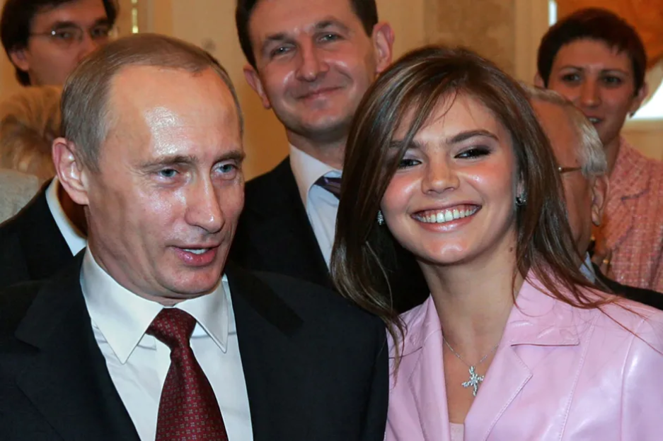 Vladimir Putin with a young woman.
