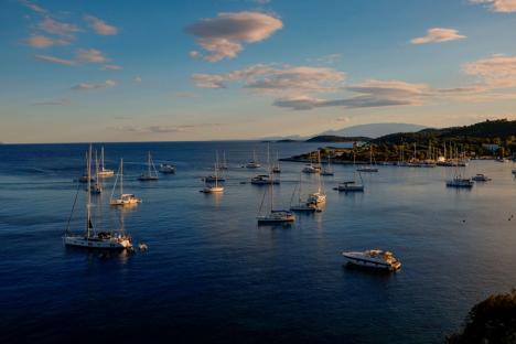 Aerial view of sailboats moored in a bay.