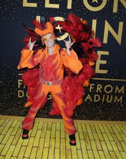 JoJo Siwa in a flame-themed costume at a Disney+ event.