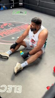 Mohammad Azar Nazir, Wakey Wines owner, sitting in a boxing ring.