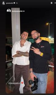 João Cancelo and Tomasworkk posing together at night.