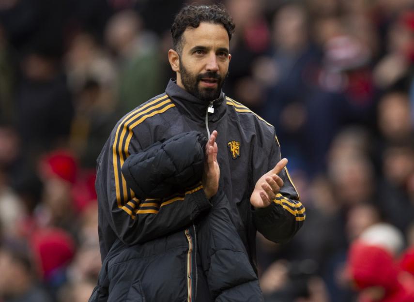 Manchester United coach clapping.