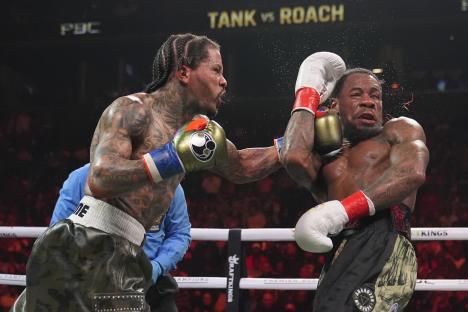 Gervonta Davis punches Lamont Roach in a boxing match.
