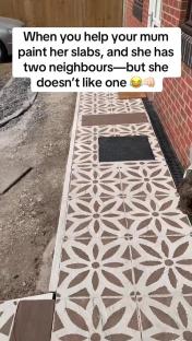 Painted patio slabs with a floral design.