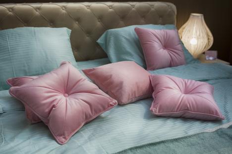 Pink pillows on a bed.