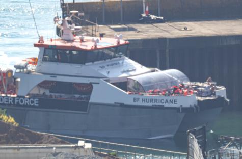 Border Force vessel BF Hurricane arriving at port with migrants.