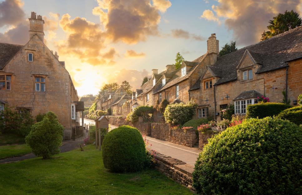 Stone houses in Bourton-on-the-Hill village at sunset.